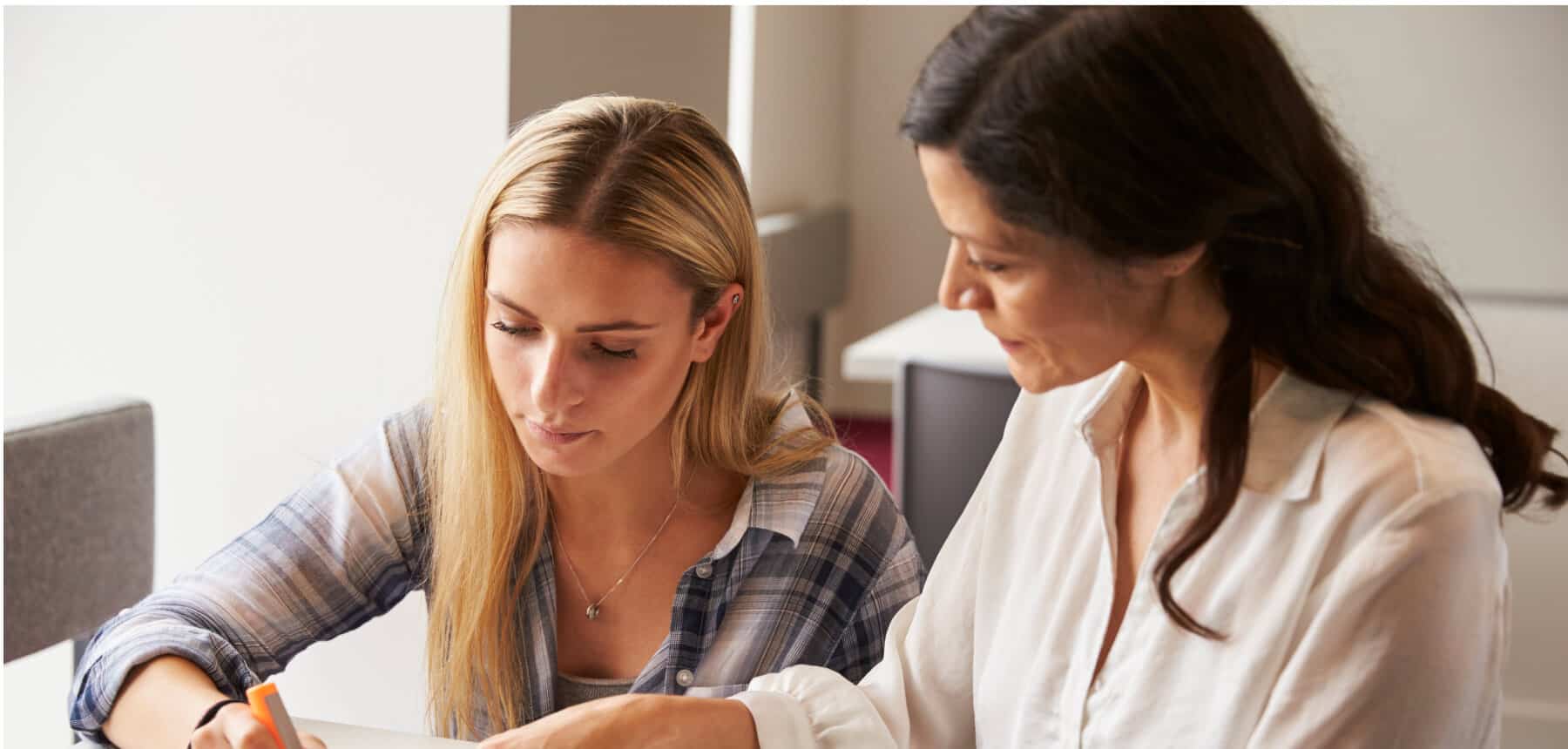 Tutor helping student with educational therapy