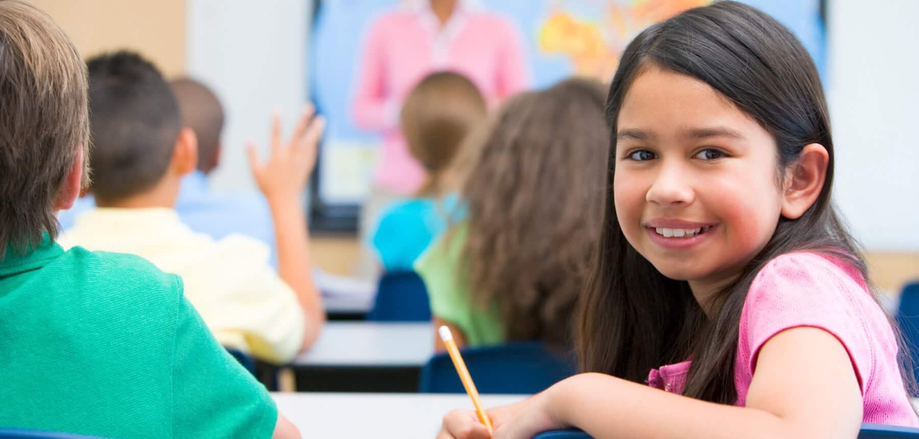 Happy student in school classroom