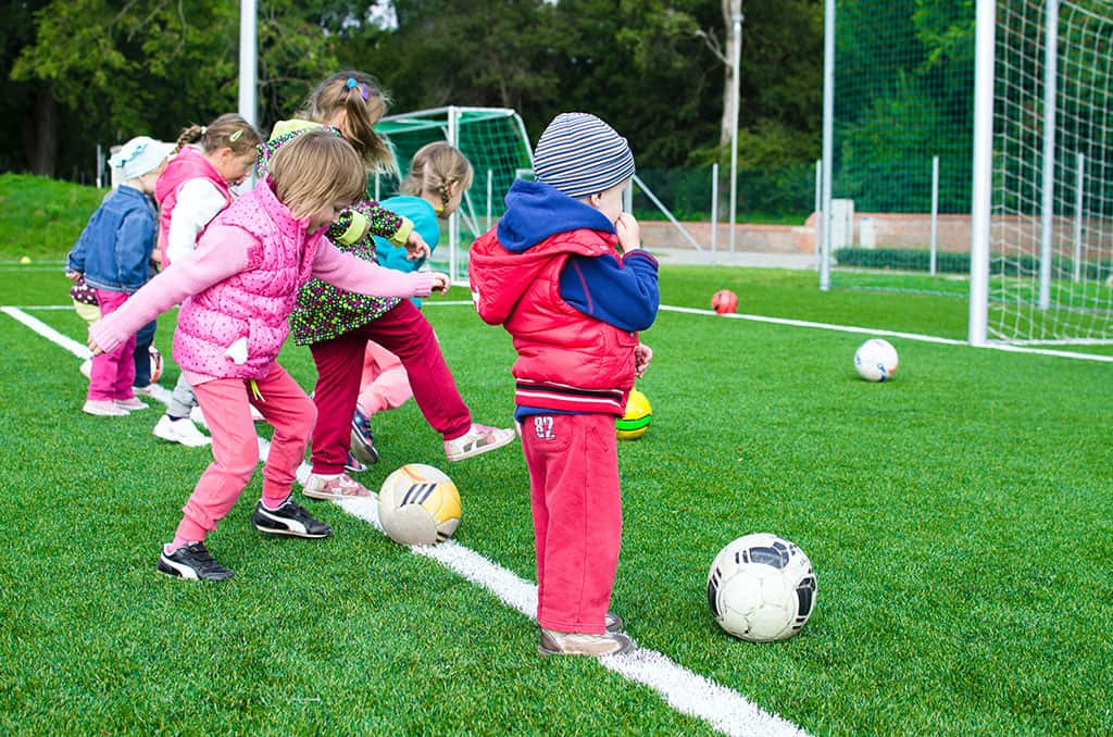 Young Children Playing Soccer