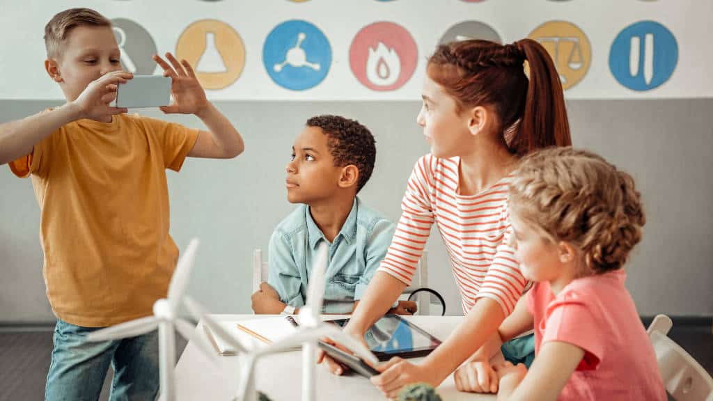 Students playing with technology in the classroom