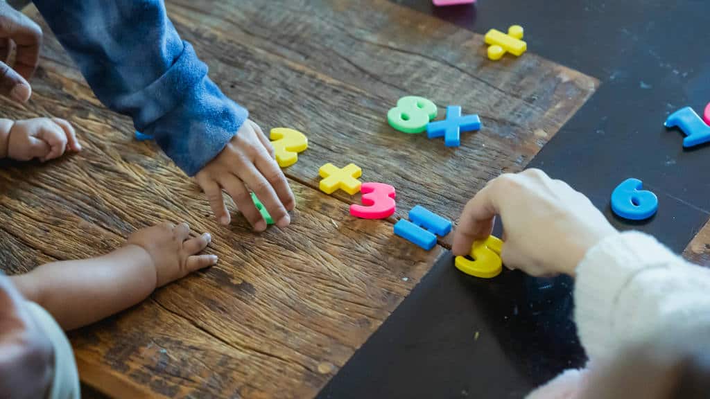 Children learning math with numbers